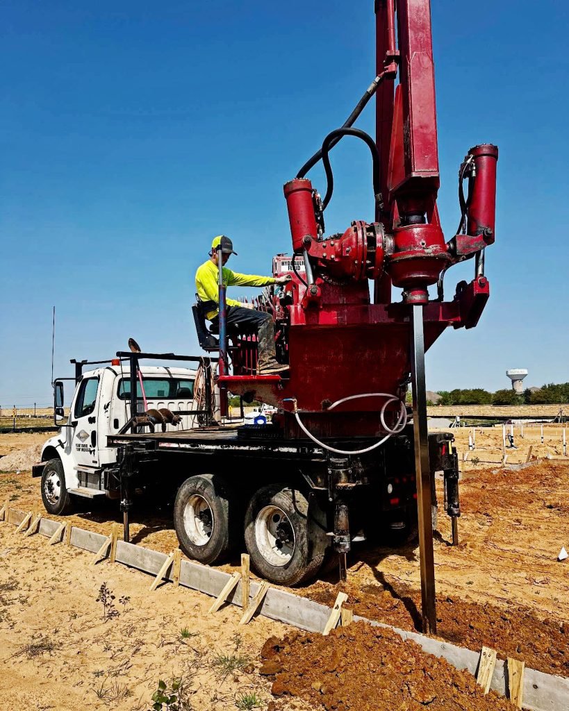 Man operating a drilling machine at FnD Piers