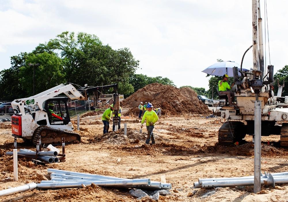 construction crew installing helical piles