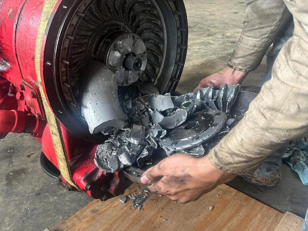 Team member is repairing a broken torque converter
