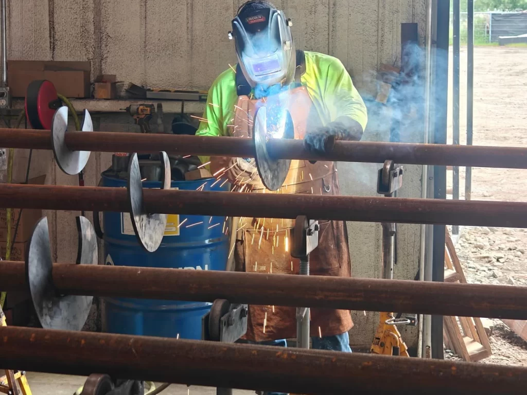 Fnd-piers-team-assembling-helical-piers-near-plano-tx