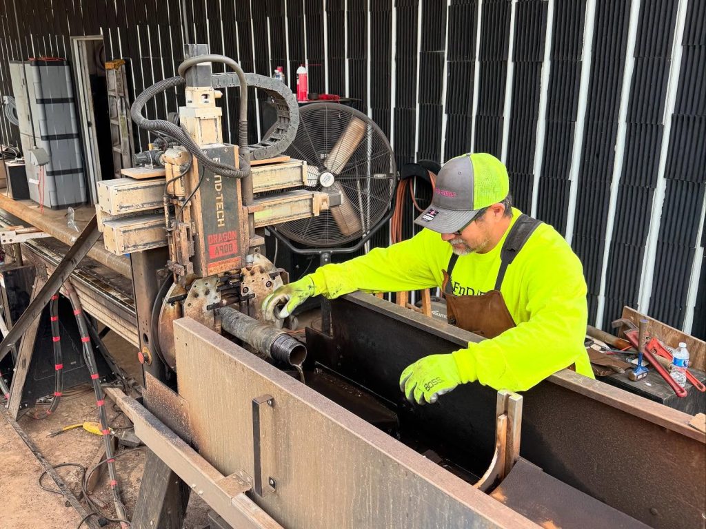 FnD Piers team member is helping construct machinery for the digging process.