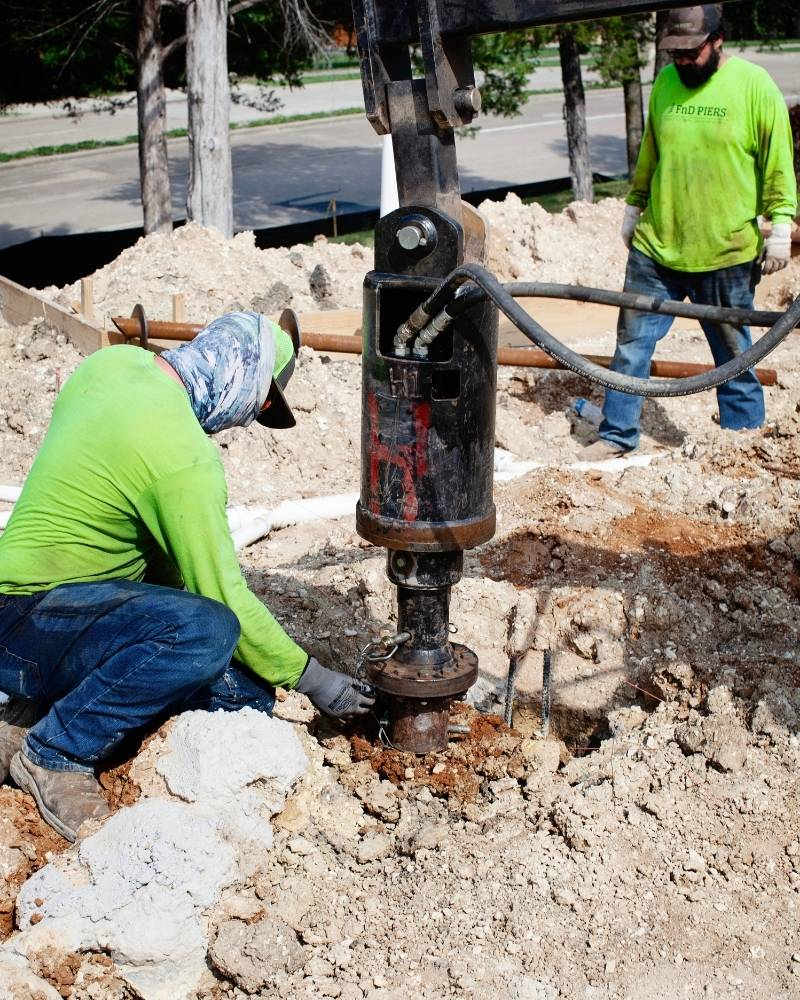 foundation repair contractors at work