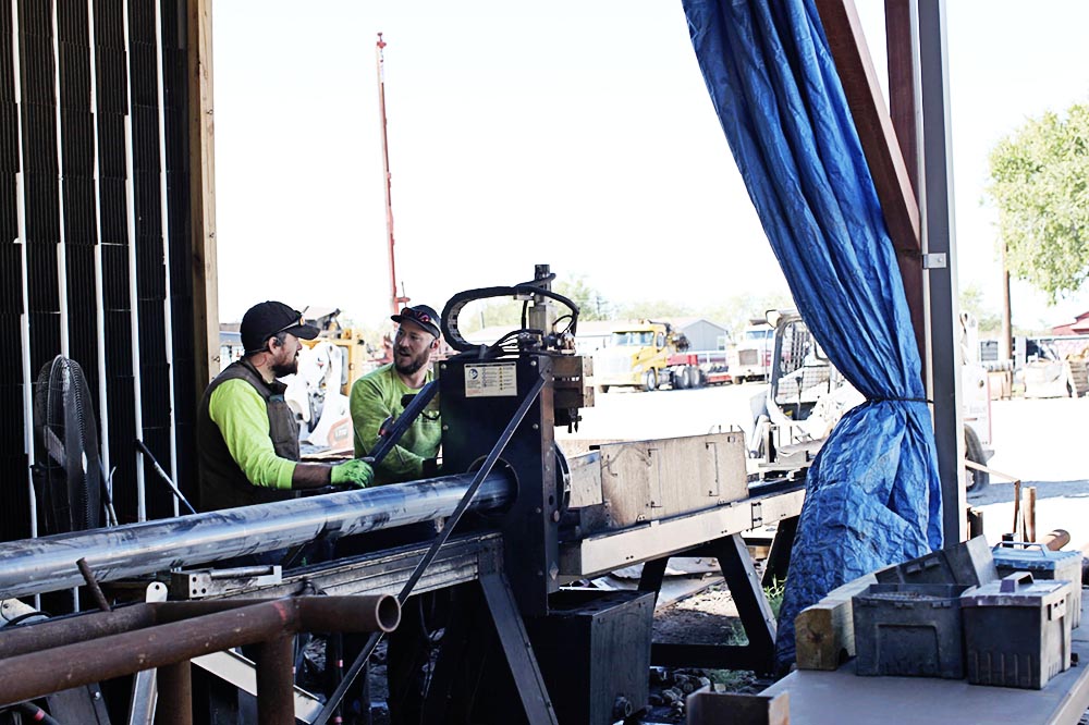 helical-pier-manufacturing-shop-workers