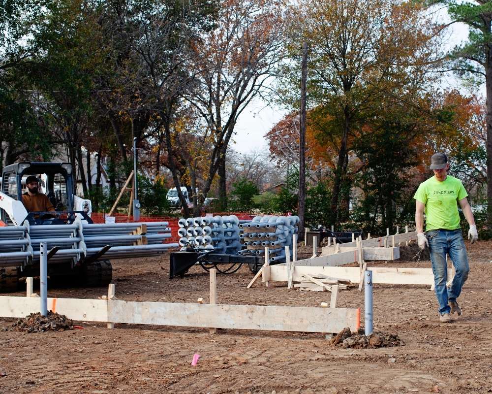 helical piers men at work fnd piers