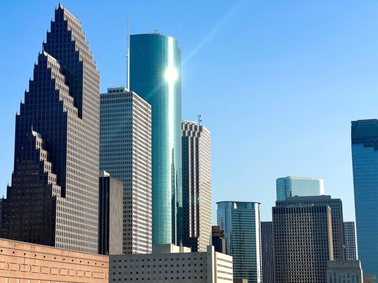Downtown Houston, Texas skyline with skyscrapers under a clear blue sky