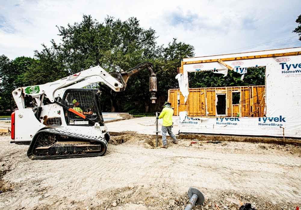 men-installing-helical-piers-for-residential