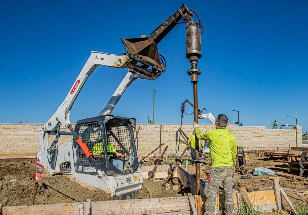 men-stalling-helical-piers-for-flood-zones