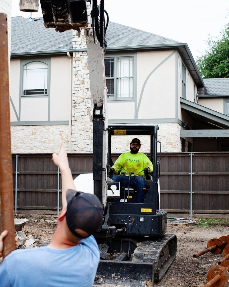 mini excavator for installing piers