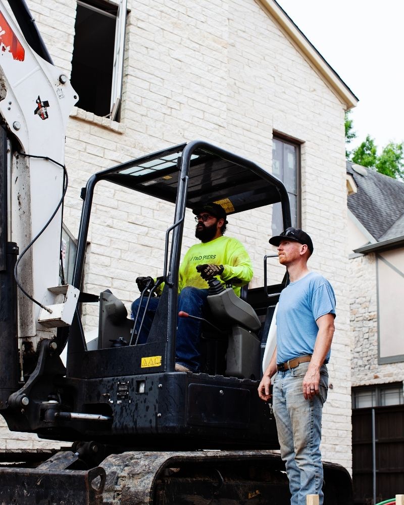 mini excavator operating concrete